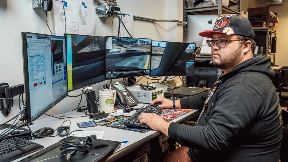 Jimmy Mai at work in the Lawrence Berkeley National Laboratory gaming lab in 2018. (Credit: Berkeley Lab)