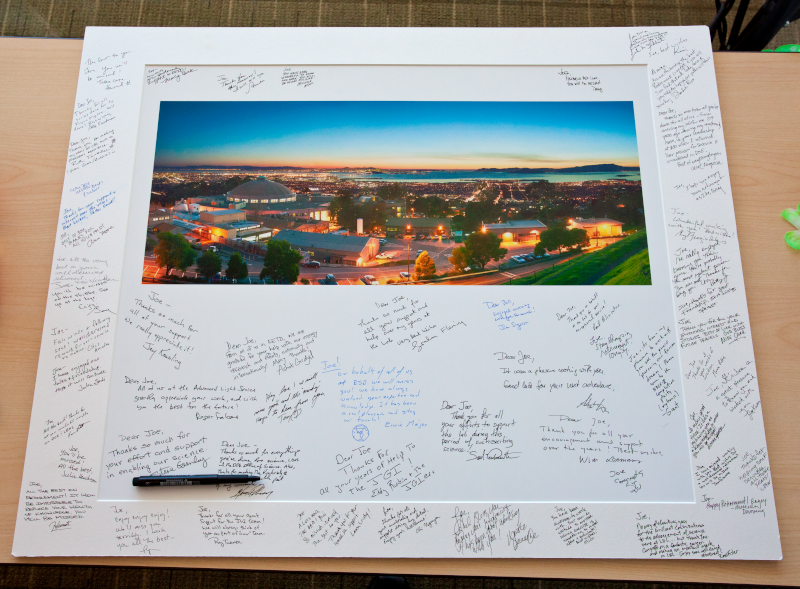Signatures from colleagues on a Berkeley Lab photo board at a retirement farewell luncheon. (Credit: Berkeley Lab)