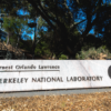 The sign on Cyclotron Road for Lawrence Berkeley National Laboratory, featuring a likeness of Ernest O. Lawrence, is seen on the way to the Blackberry Creek Entrance Gate, 06/26/2020, Berkeley, California. (Credit: Thor Swift/Berkeley Lab)
